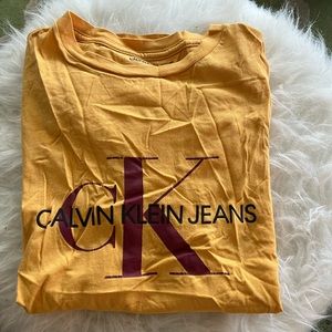 Calvin Klein Tee - size: men’s small - color: yellow w/ red detailing